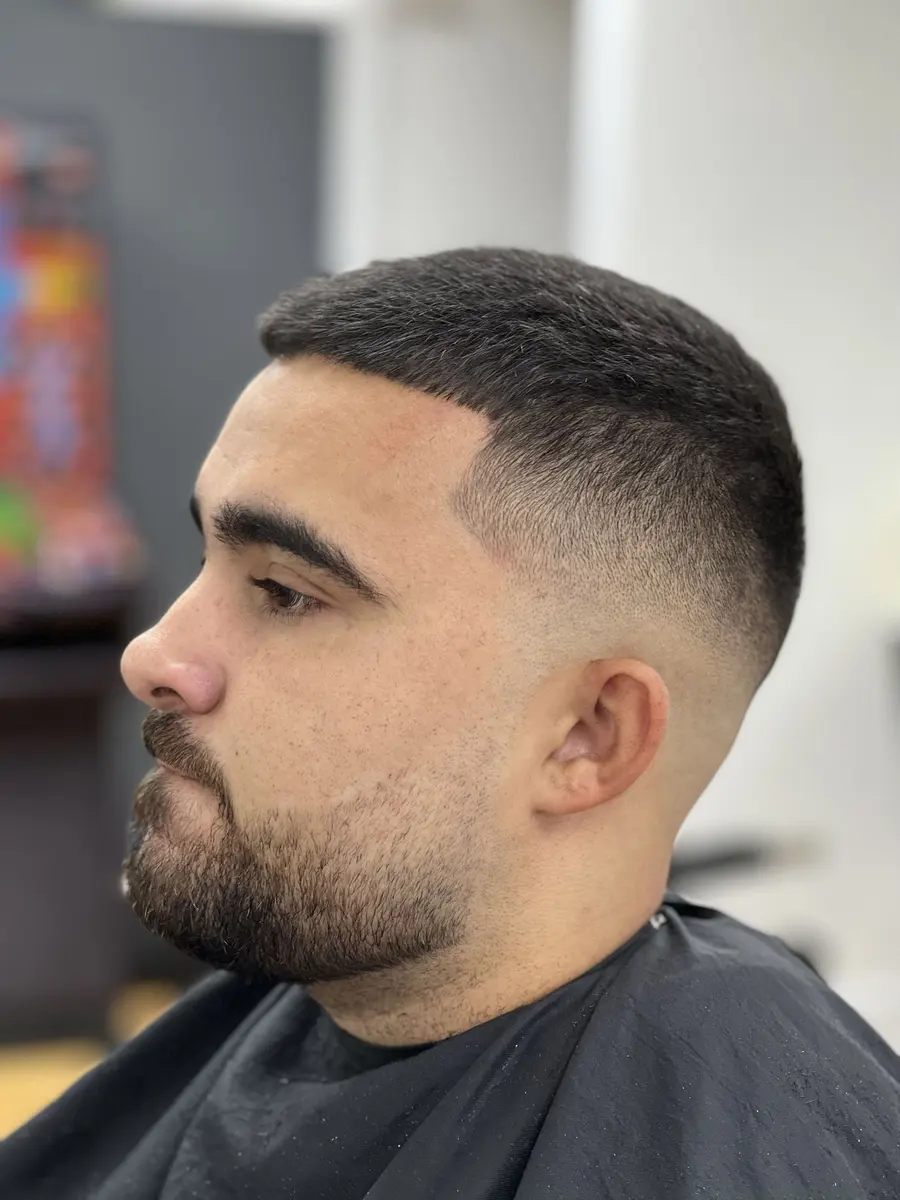 Men's skin fade with sharp beard shaping