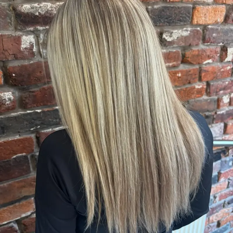 Sleek straight blonde with bright, blended highlights